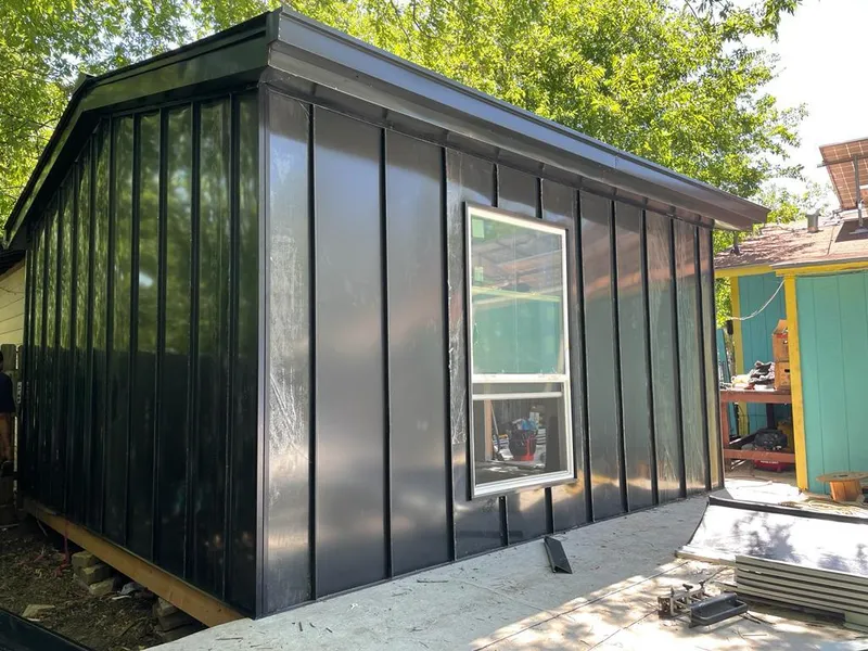 Black standing seam metal wall panels for Metal Roof Installation in Granville