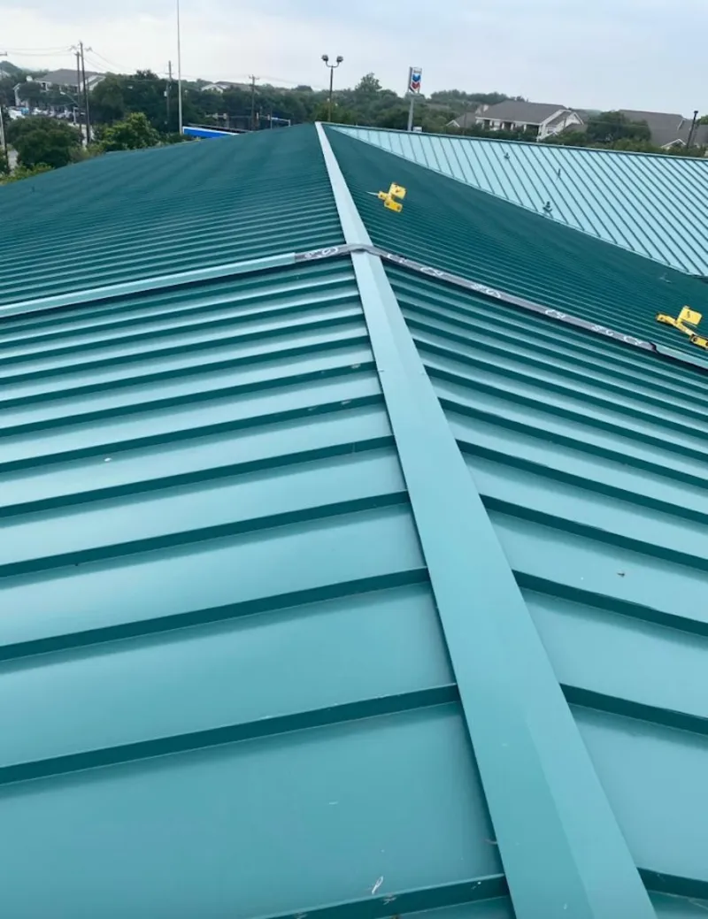 Green commercial metal roof ridge and valley for Metal Roof Repair in Granville