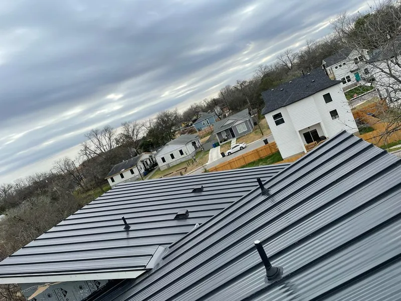 Standing seam metal roof panels with vents for Skylight Repair in Granville